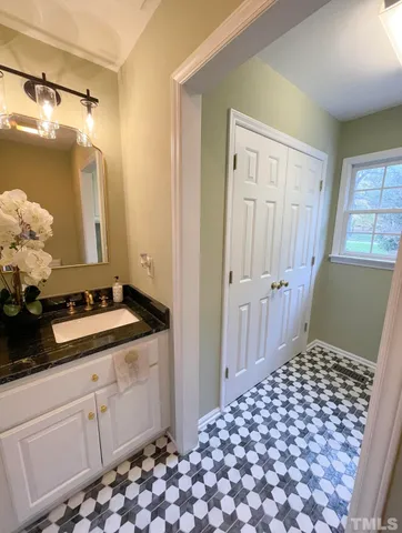 a bathroom with a tub and sink