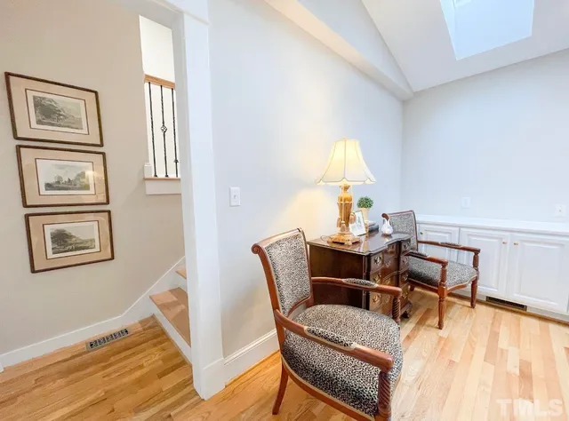 a bedroom with a bed and a table