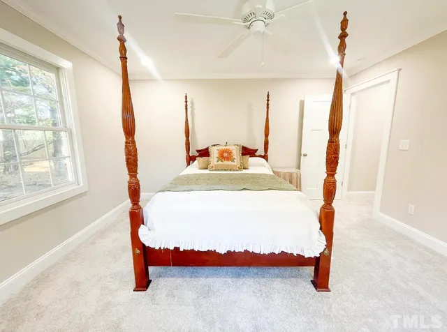 a bathroom with a granite countertop toilet a mirror and a sink