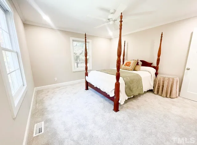 a bathroom with a double vanity sink mirror and shower
