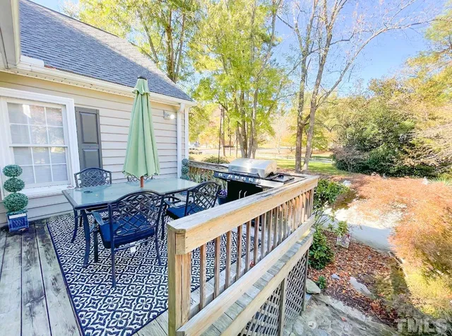 a view of a patio with couches table and chairs and potted plants