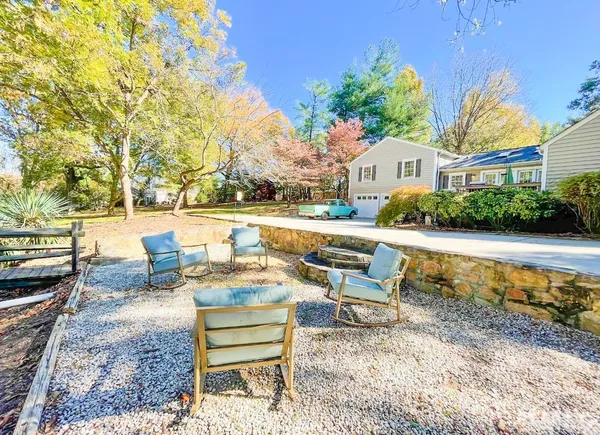 a view of a yard with a tree