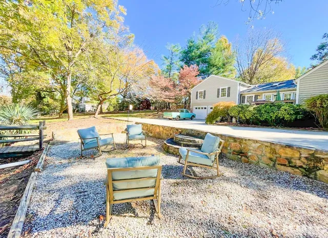 a view of a yard with a tree
