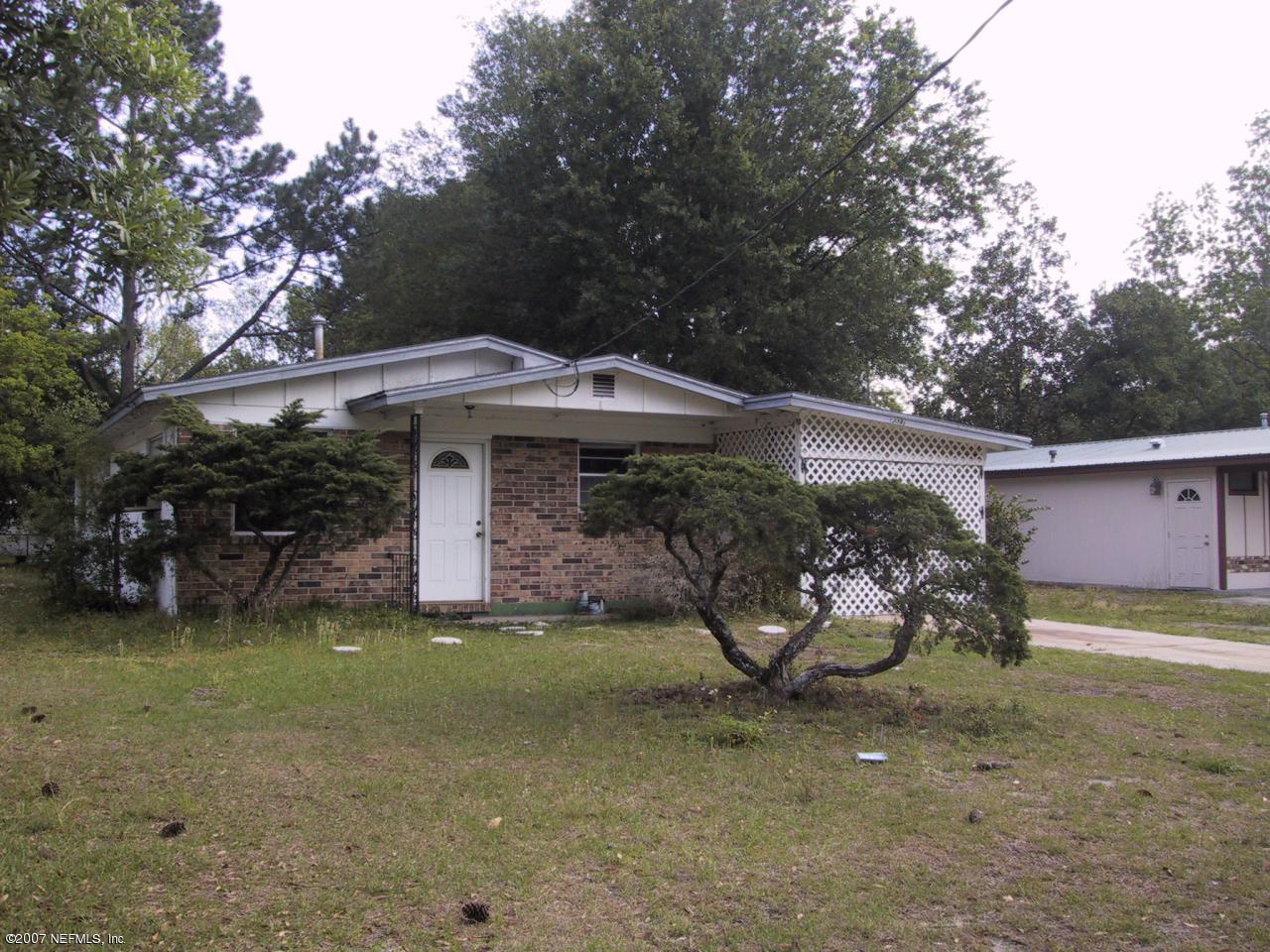 7327 Melvin Road Jacksonville, FL 32210 - Photo 2 of 2 a view of a house with backyard and sitting area
