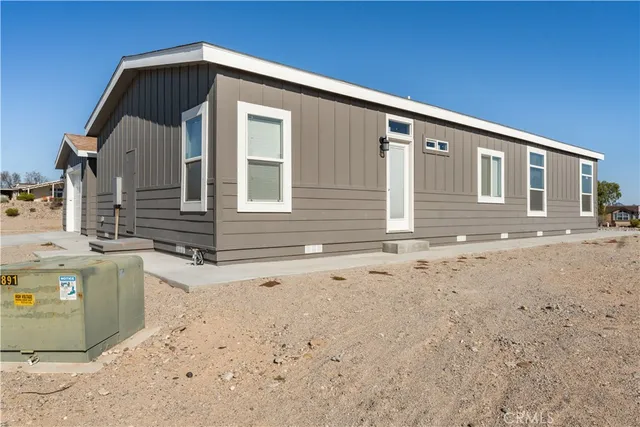 a front view of a house with parking