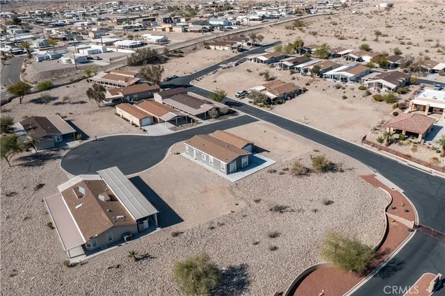 an aerial view of a house with a swimming pool