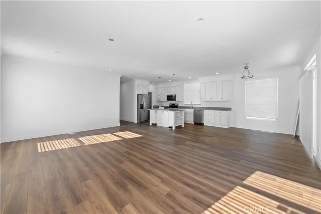 a view of a kitchen with a wooden floor