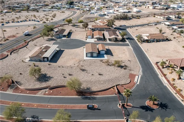 an aerial view of a backyard with seating space