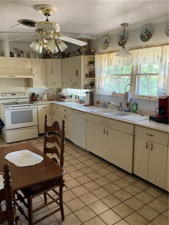 207 Castle Avenue Waco, TX 76710 - Photo 13 of 24 a kitchen with a sink cabinets and window