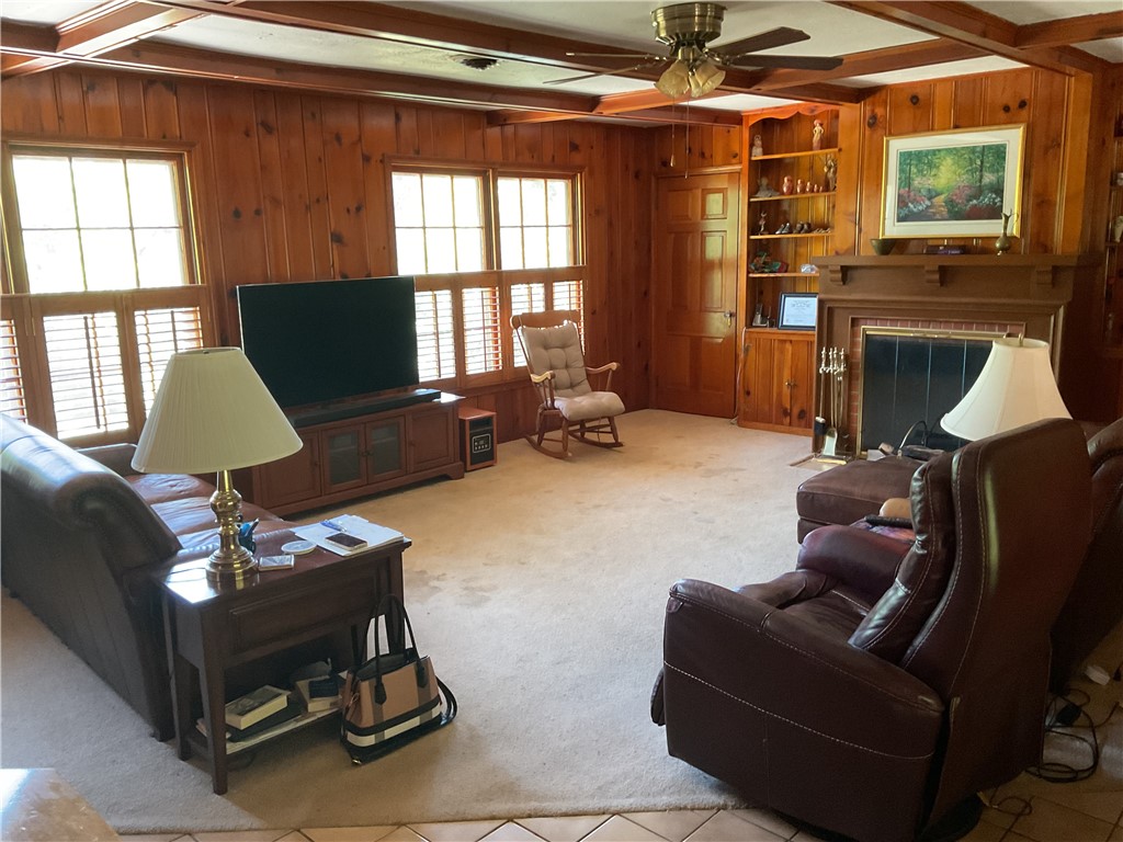 207 Castle Avenue Waco, TX 76710 - Photo 8 of 24 a living room with furniture a flat screen tv and a window