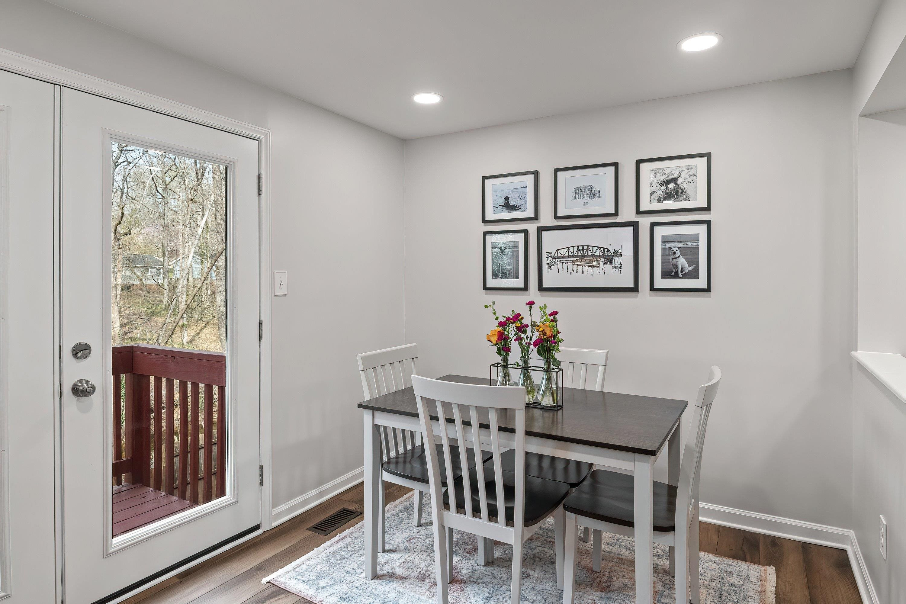 7286 Shellburne Drive Raleigh, NC 27612 - Photo 13 of 35 a view of a dining room with furniture window and wooden floor