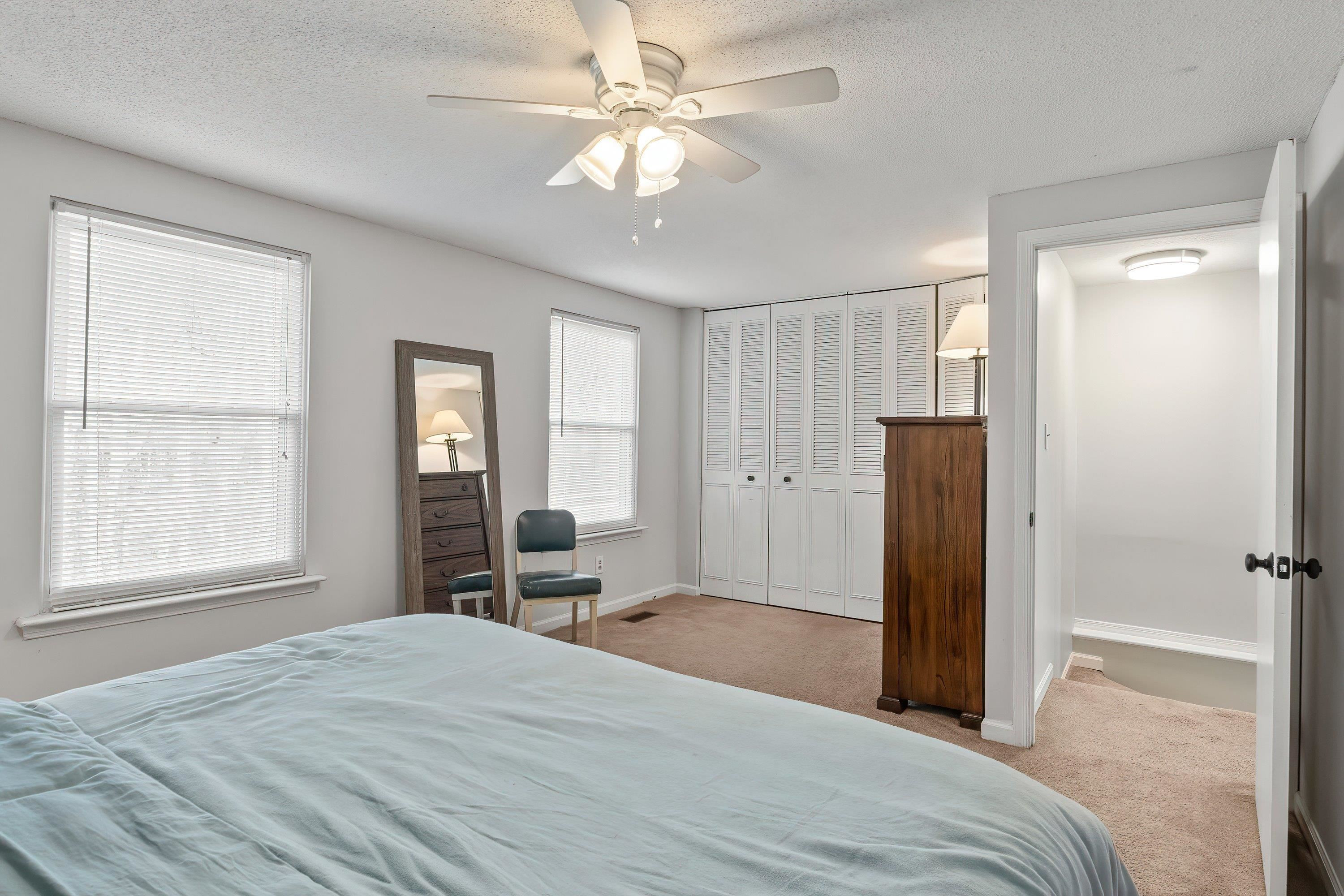 7286 Shellburne Drive Raleigh, NC 27612 - Photo 17 of 35 a bedroom with a bed and a window