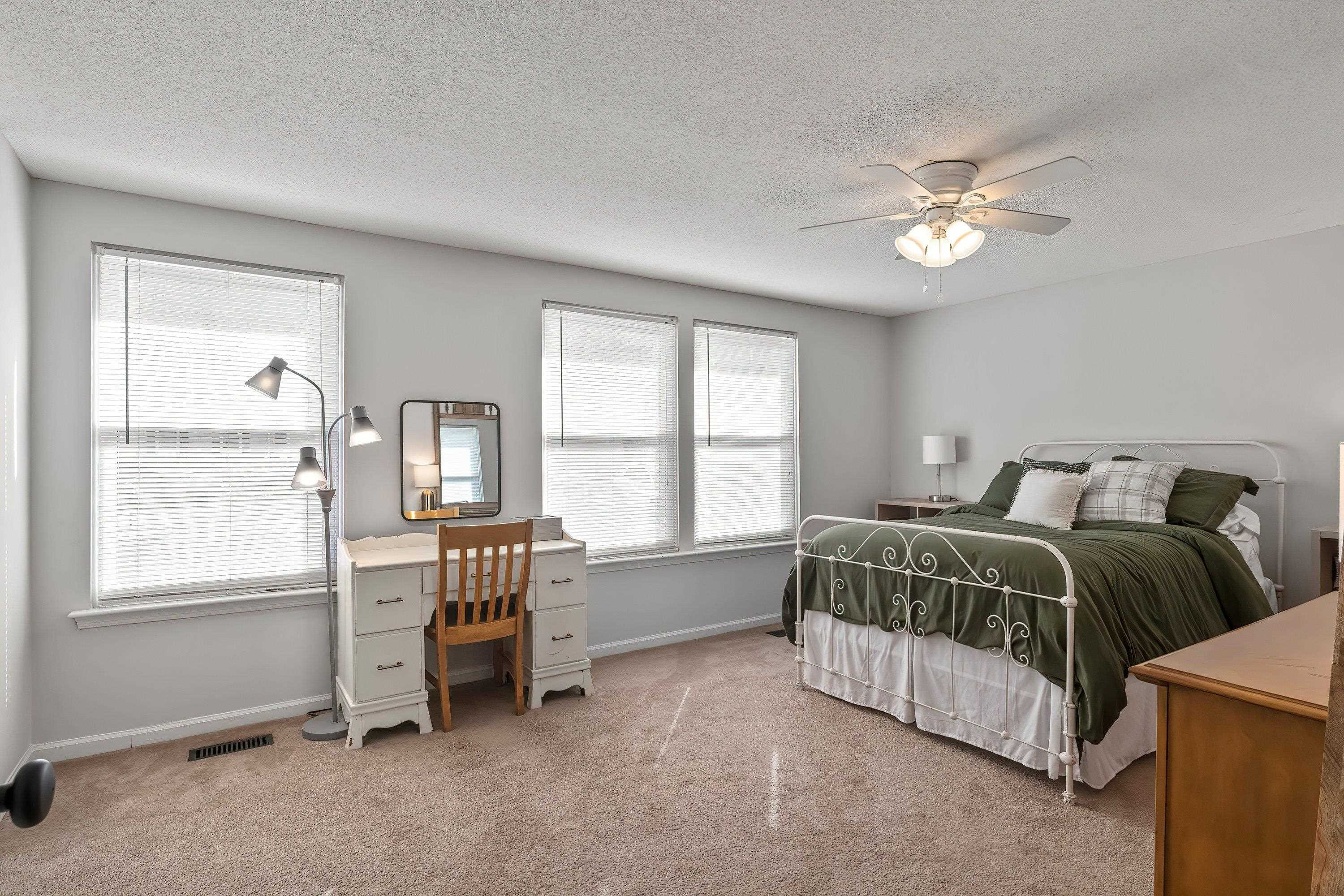 7286 Shellburne Drive Raleigh, NC 27612 - Photo 20 of 35 a spacious bedroom with two beds and a window