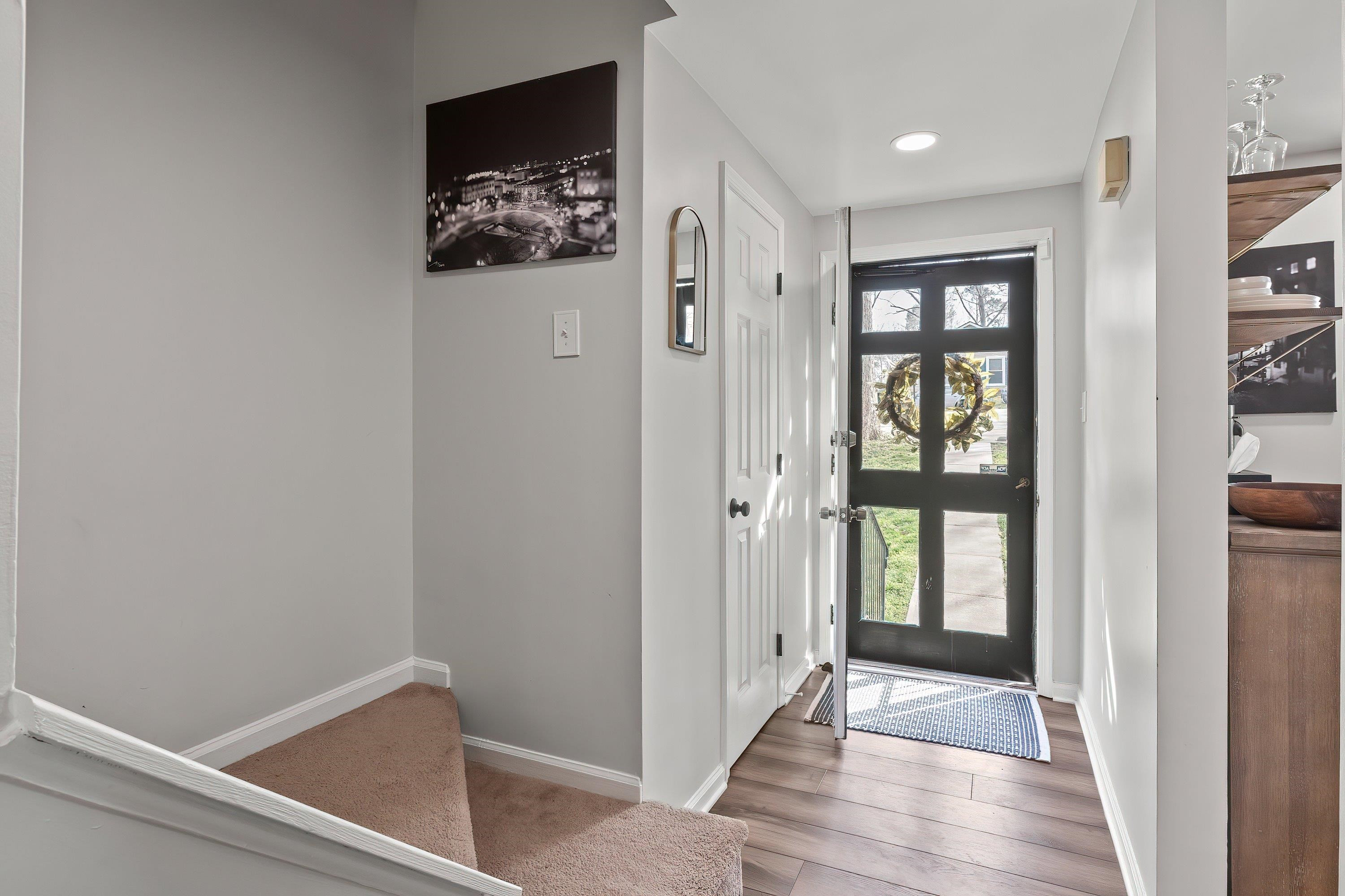 7286 Shellburne Drive Raleigh, NC 27612 - Photo 2 of 35 a view of an entryway with wooden floor