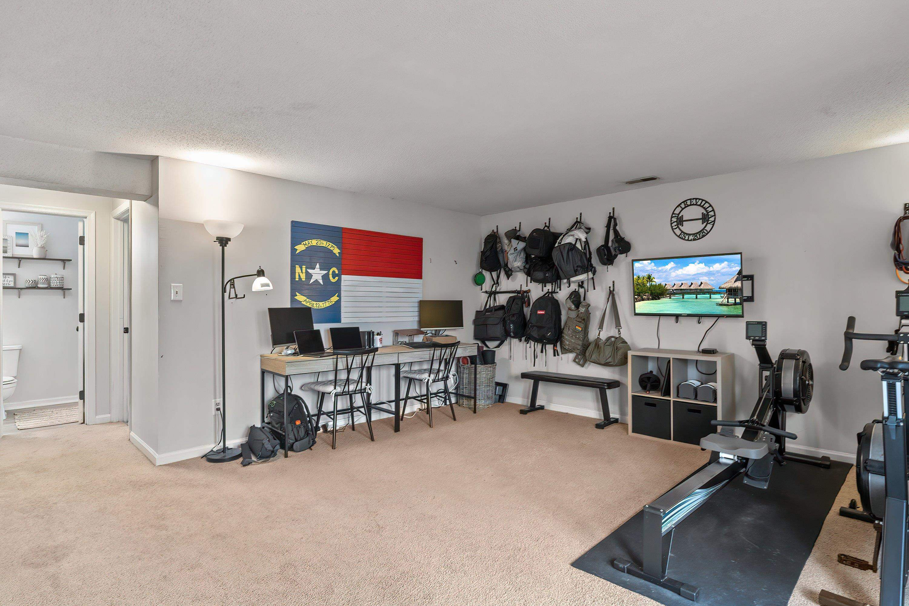 7286 Shellburne Drive Raleigh, NC 27612 - Photo 24 of 35 a view of a room with gym equipment