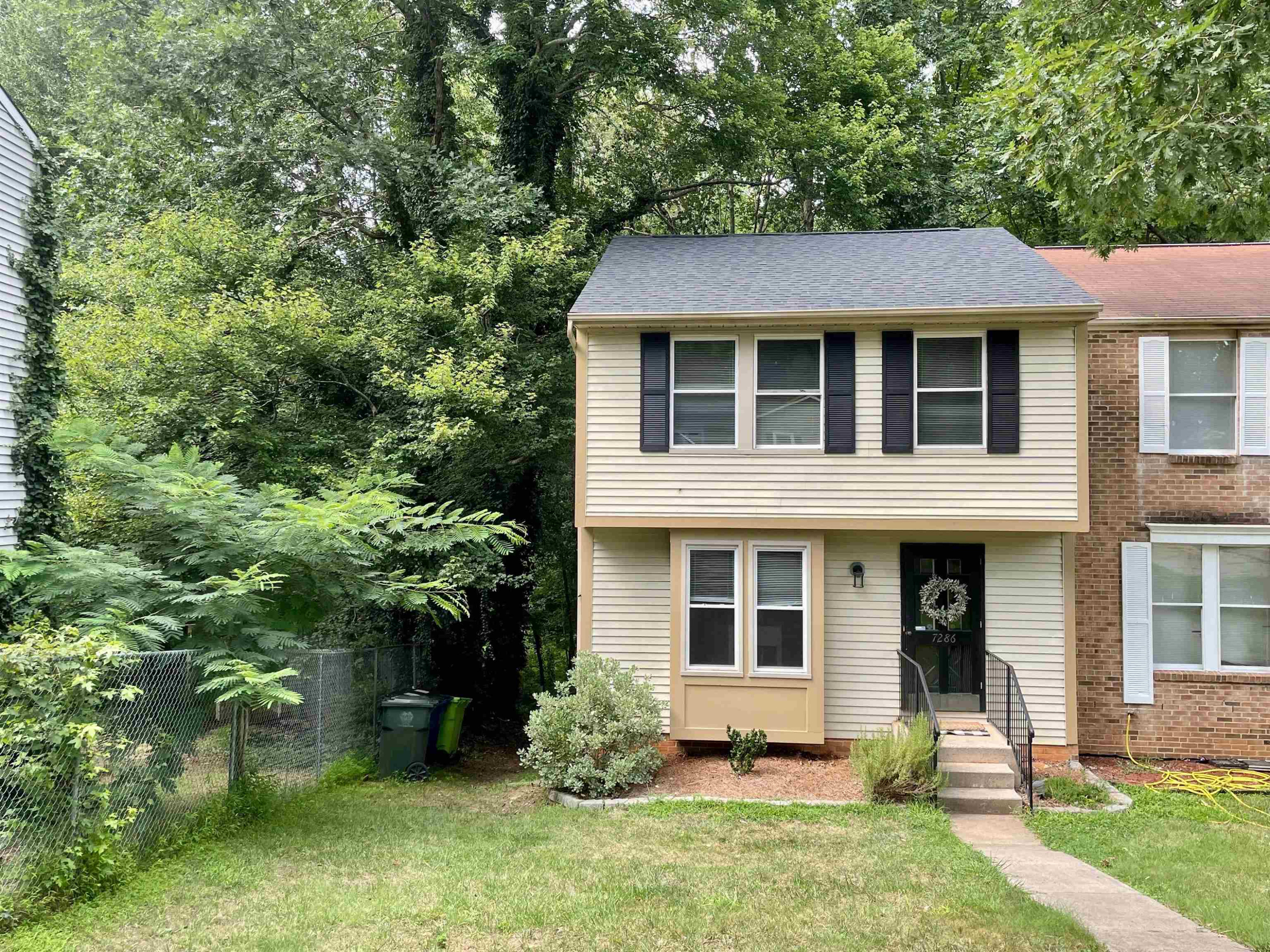 7286 Shellburne Drive Raleigh, NC 27612 - Photo 34 of 35 front view of a house with a yard