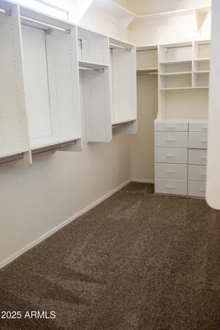 a view of an empty walk in closet