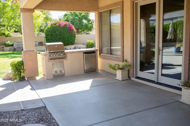 a view of a house with backyard porch and sitting area