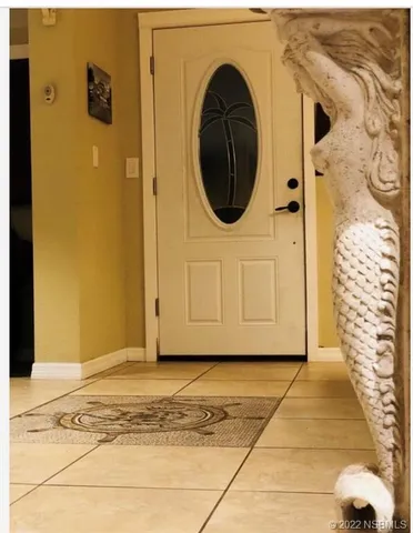 a view of a brick house with entryway
