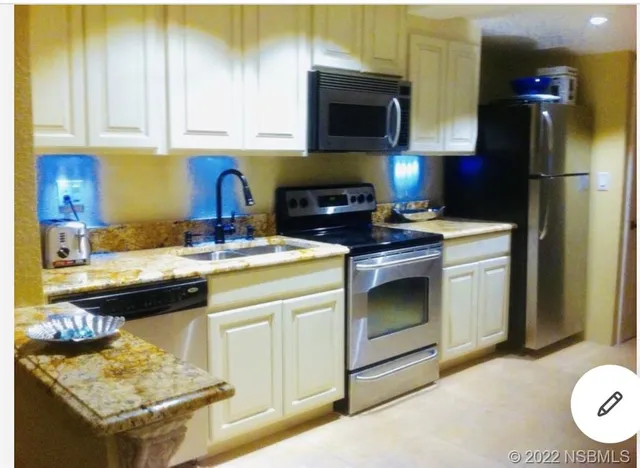 a kitchen with a stove and a microwave