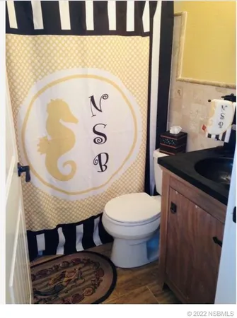 a bathroom with a toilet and a sink