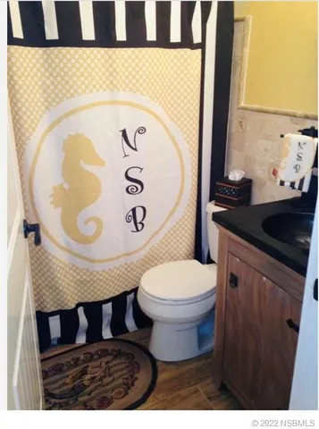 a bathroom with a toilet and a sink