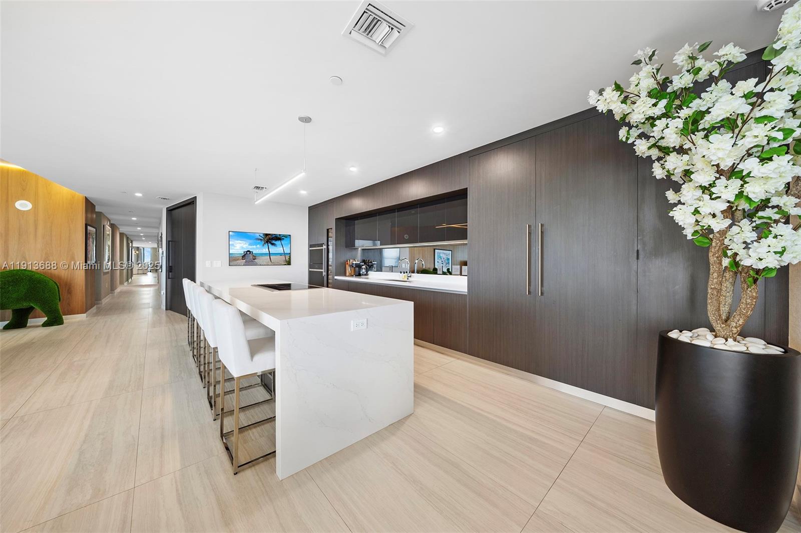 851 Northeast 1st Avenue, Unit 5312 Miami, FL 33132 - Photo 11 of 53 a living room with furniture and a potted plant