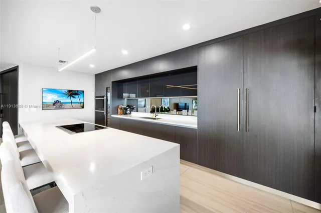 a view of a balcony with couches and wooden floor