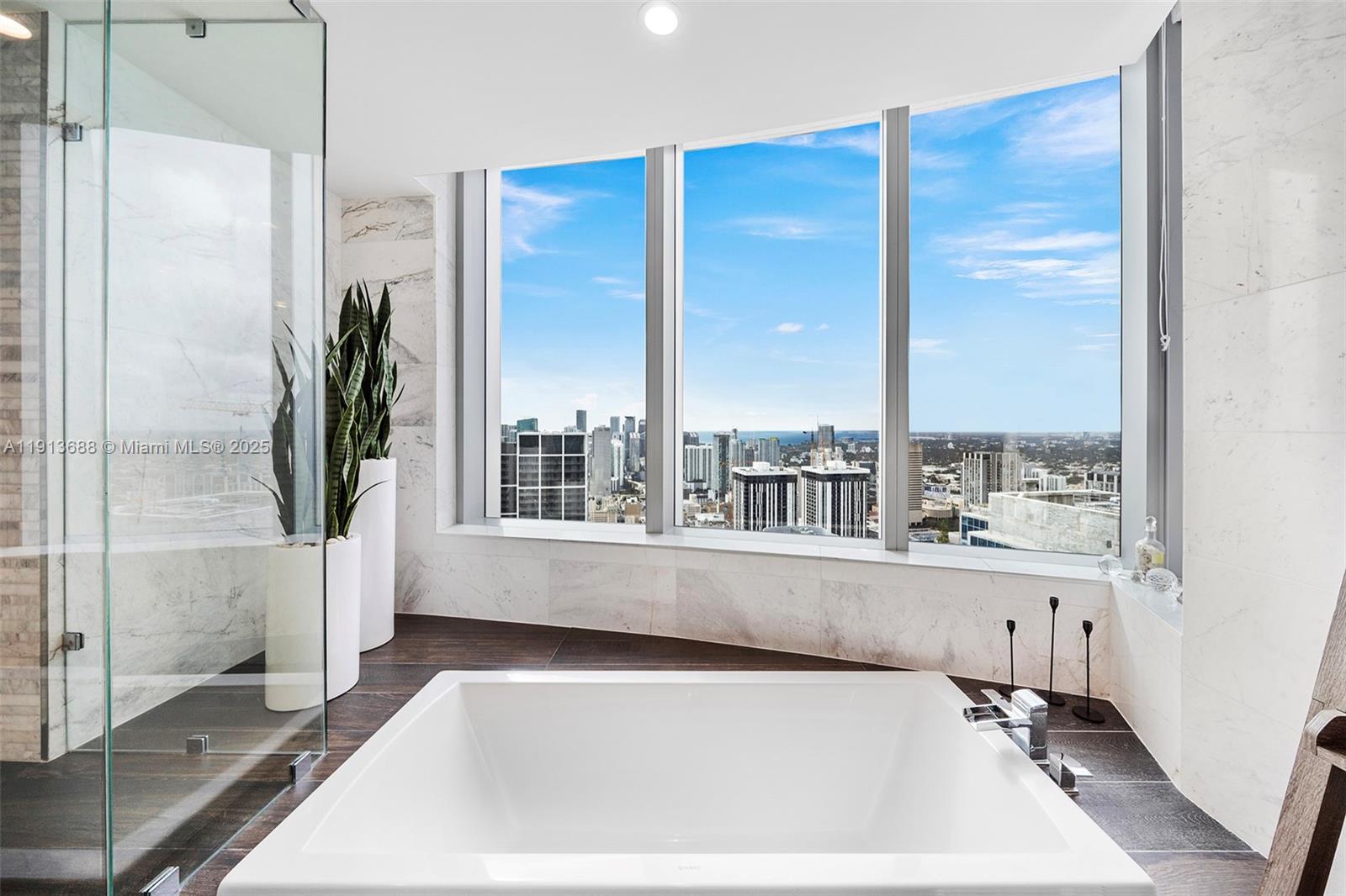 851 Northeast 1st Avenue, Unit 5312 Miami, FL 33132 - Photo 32 of 53 a view of a bathtub in a room