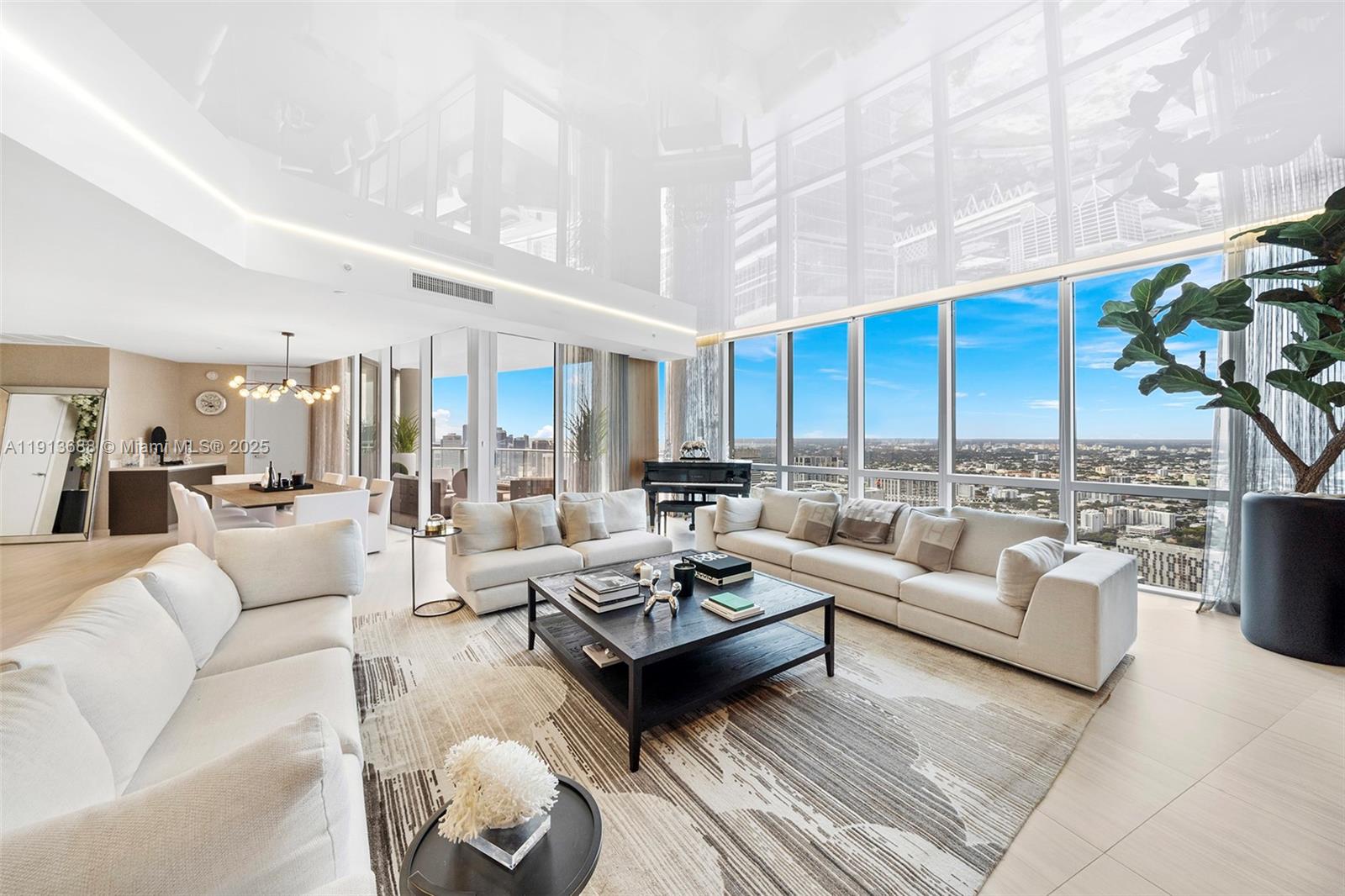 851 Northeast 1st Avenue, Unit 5312 Miami, FL 33132 - Photo 4 of 53 a living room with furniture kitchen view and a chandelier