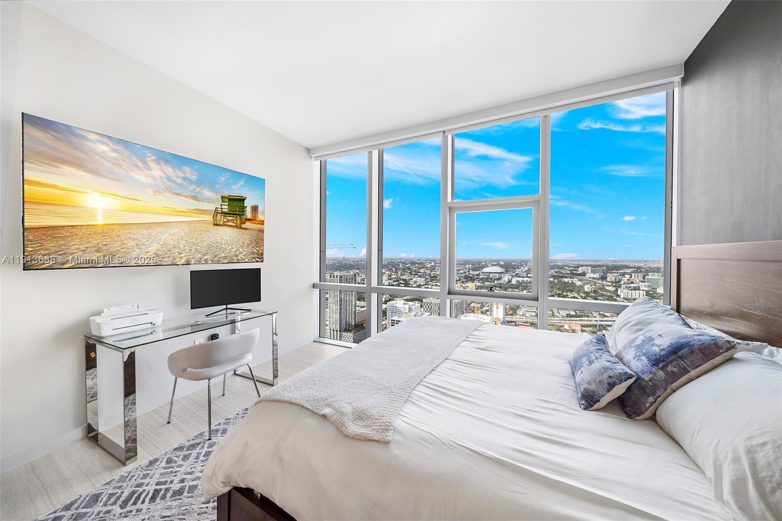 851 Northeast 1st Avenue, Unit 5312 Miami, FL 33132 - Photo 43 of 53 a bedroom with a bed and large window