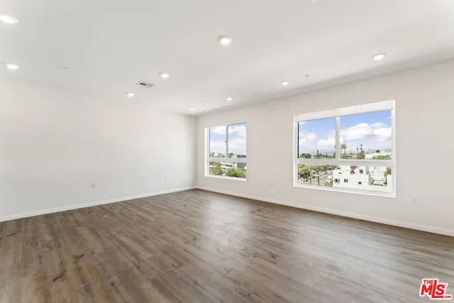 a view of kitchen with wooden floor