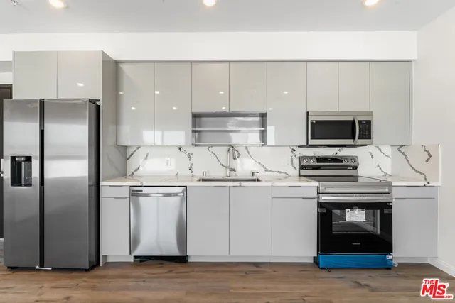 a view of a hallway with washer and dryer