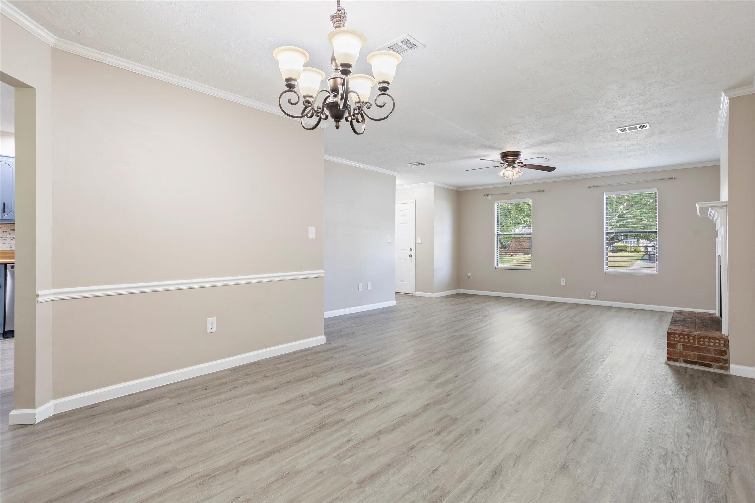 305 Manchester Court Grovetown, GA 30813 - Photo 9 of 13 wooden floor in an empty room with a window