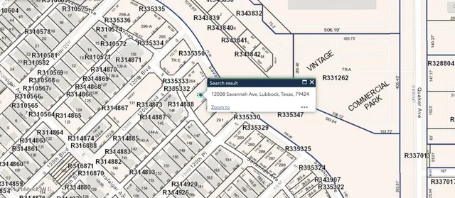 a picture of a wall with a white comforter and a painting on the wall