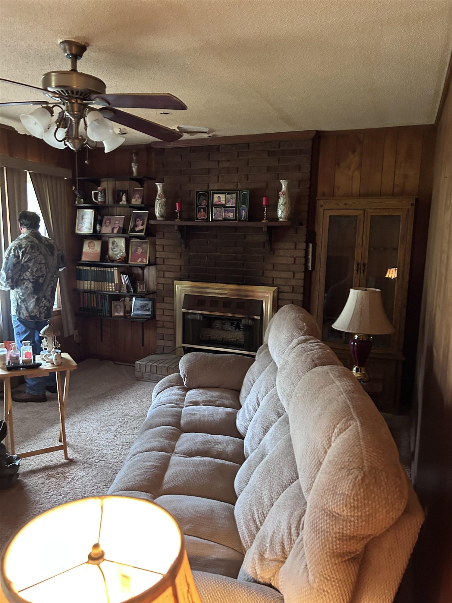 4145 Swannie Coble Road Snow Camp, NC 27349 - Photo 5 of 11 a living room with furniture a flat screen tv and a fireplace