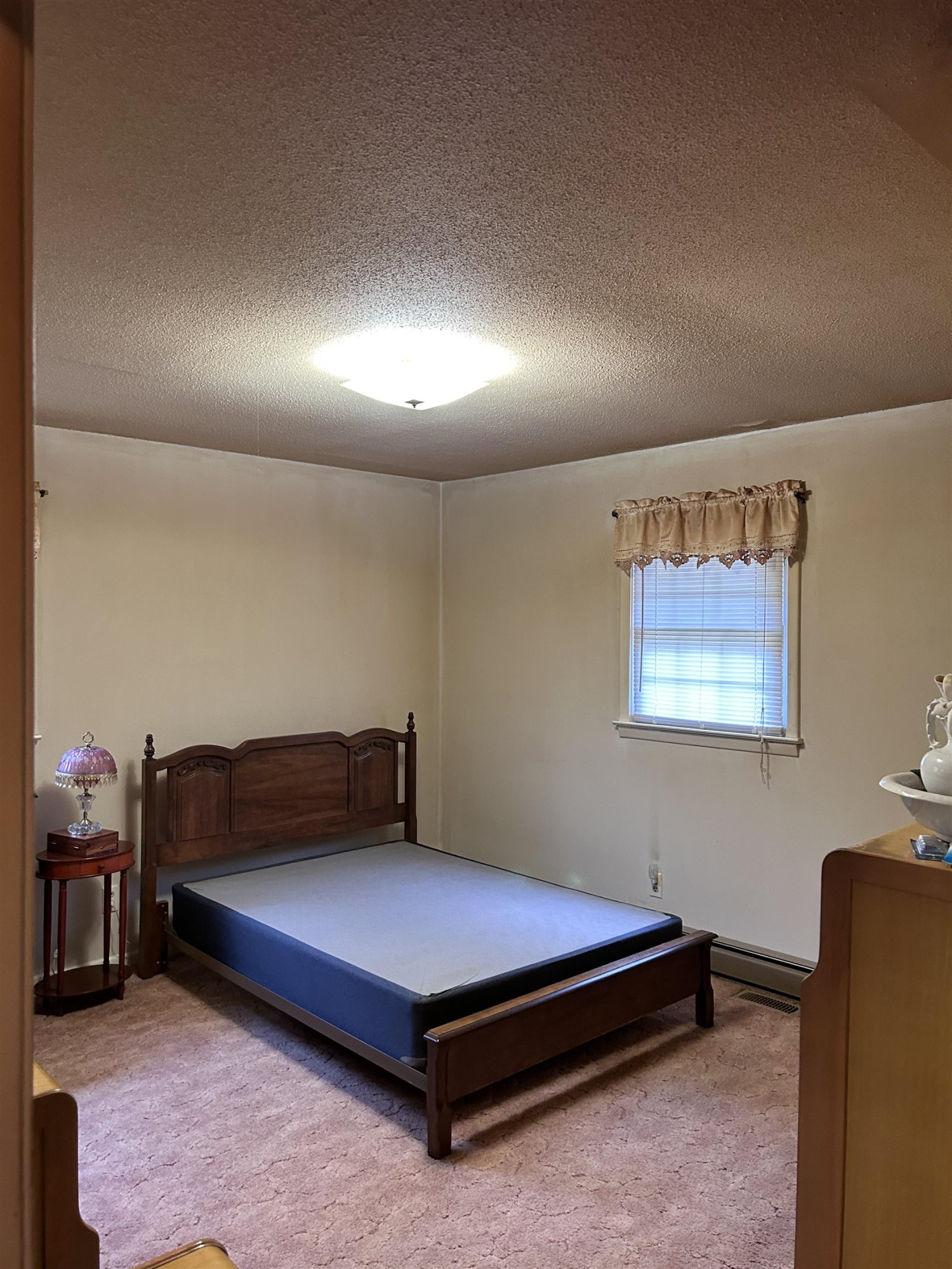 4145 Swannie Coble Road Snow Camp, NC 27349 - Photo 8 of 11 a bedroom with a bed and furniture