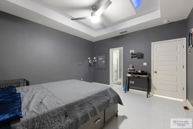 a bedroom with a bed and dresser