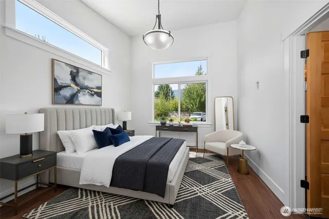 a bedroom with bed and a window