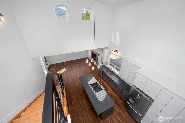 a view of an entryway with wooden floor