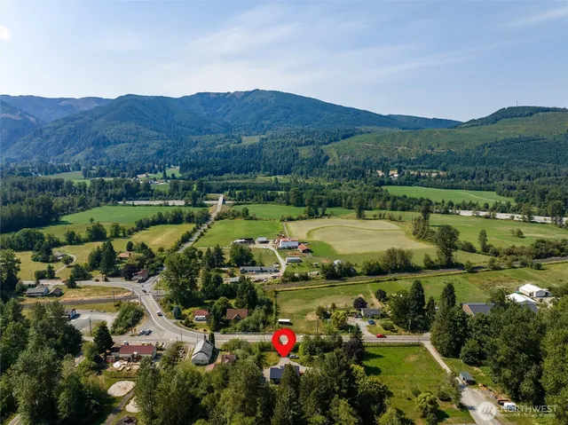 an aerial view of a town with couple of houses