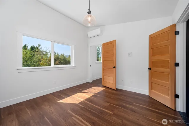 a bedroom with a bed and a couch