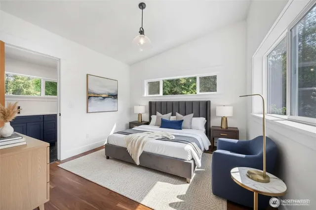 a bathroom with a toilet sink a mirror and bathtub