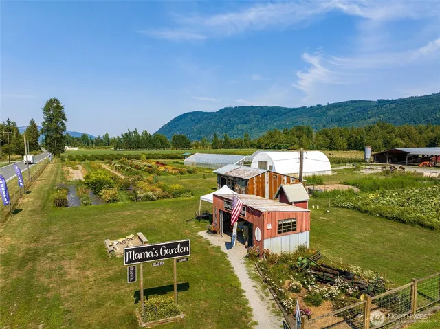 a view of backyard with swimming pool and outdoor seating
