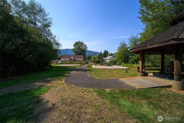 an aerial view of residential house and car parked
