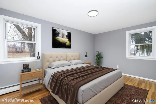 a view of a room with wooden floor and bathroom