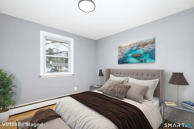 a view of a room with wooden floor and window