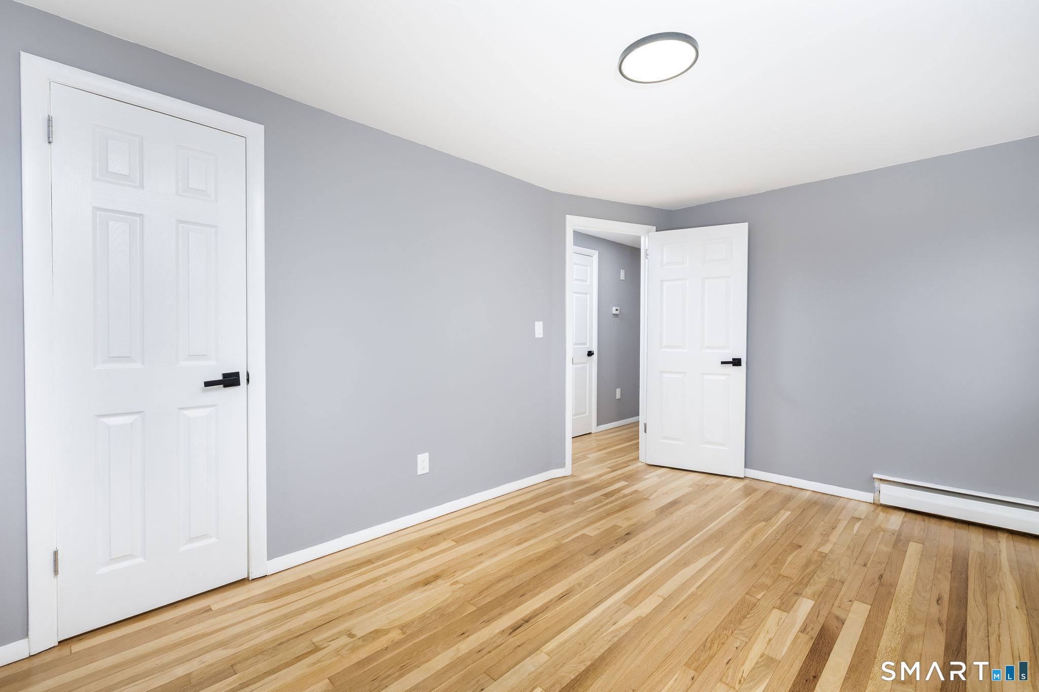555 Graham Road South Windsor, CT 06074 - Photo 22 of 39 a view of a room with wooden floor and bathroom
