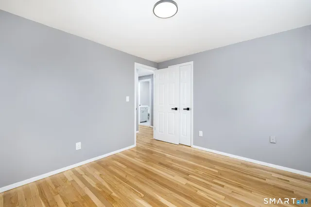 a bathroom with a toilet sink and vanity