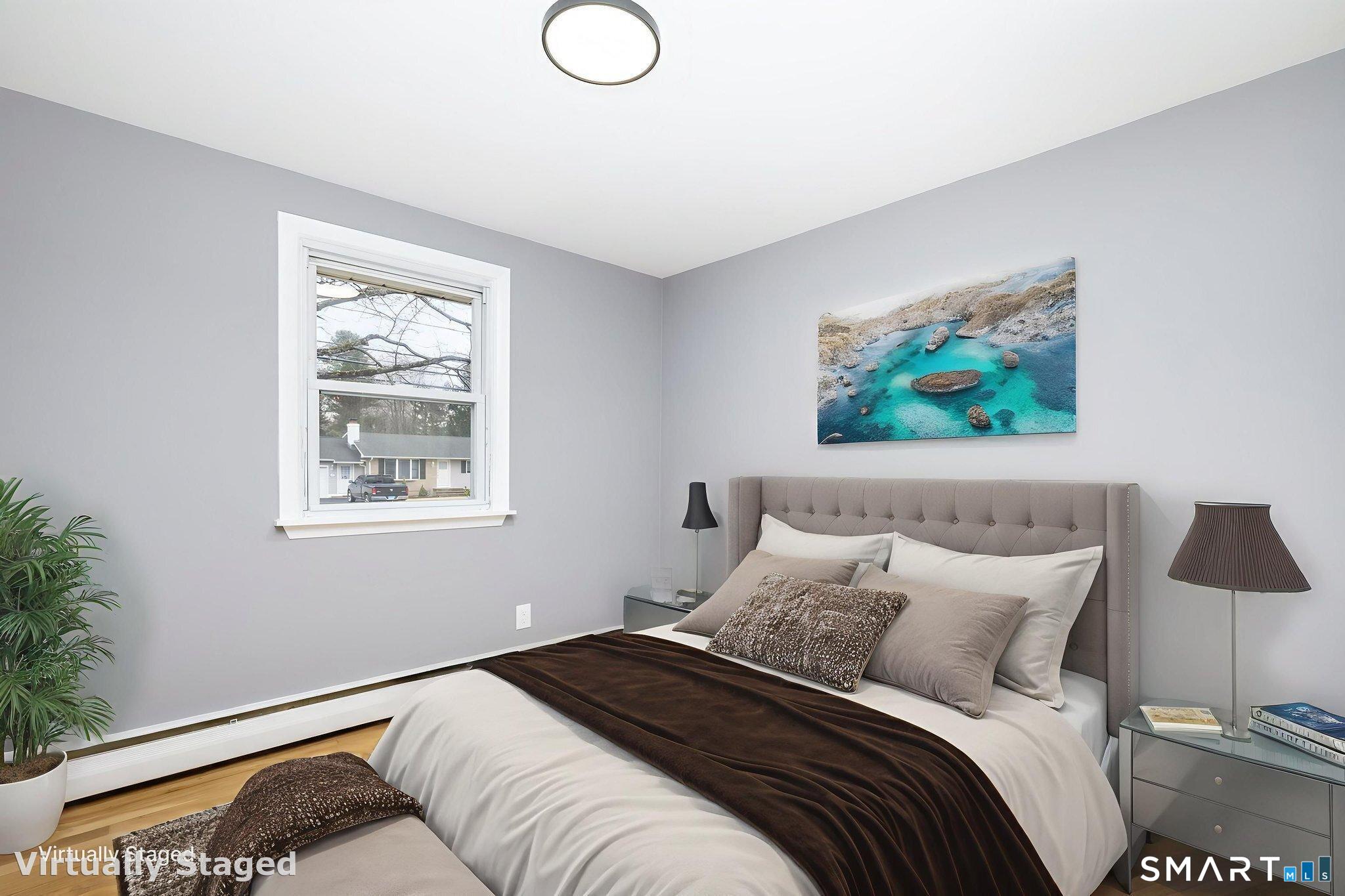 555 Graham Road South Windsor, CT 06074 - Photo 24 of 39 a bedroom with a bed and a painting on the wall